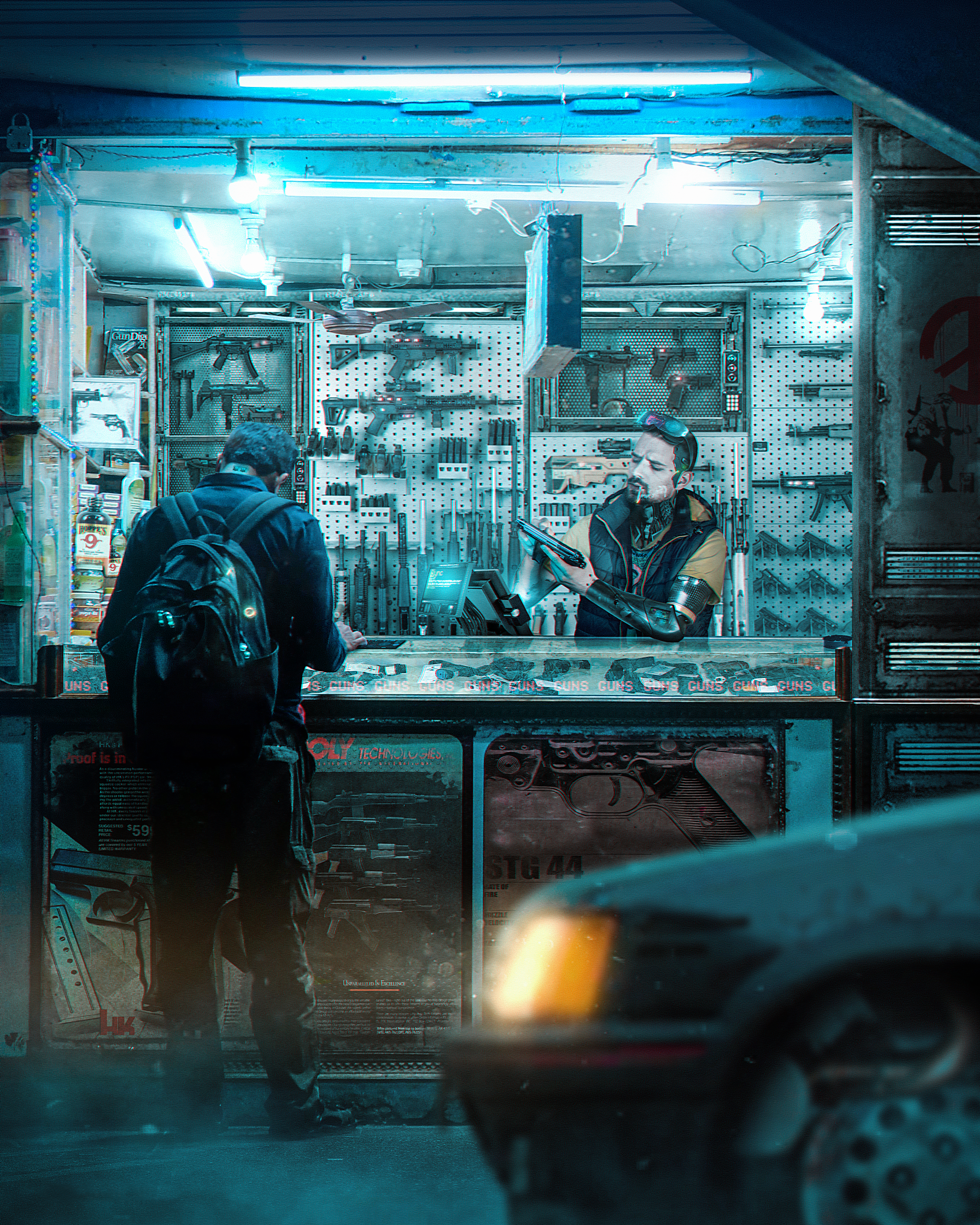 A person wearing a backpack considers an array of weaponry at a street-vendor's stall; an assortment of guns and other weapons are displayed on the wall behind the vendor.